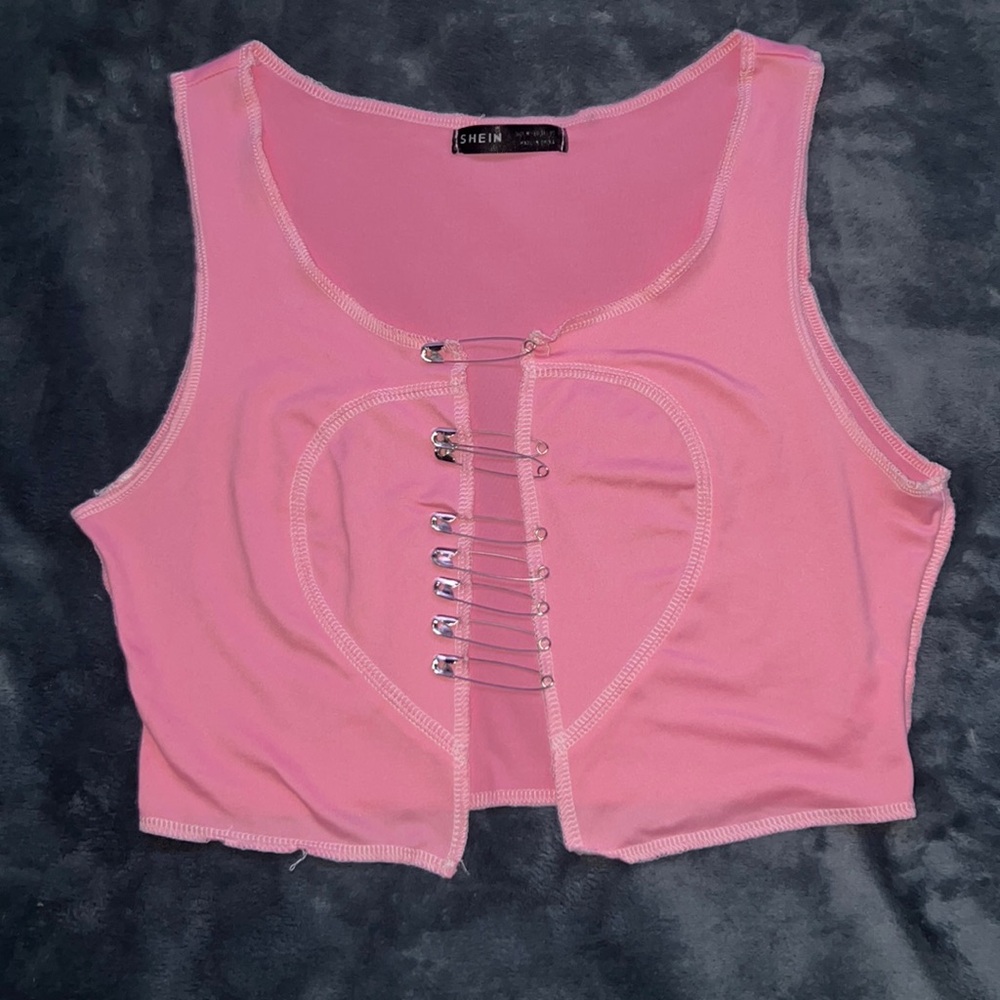 Pink crop top with safety pins